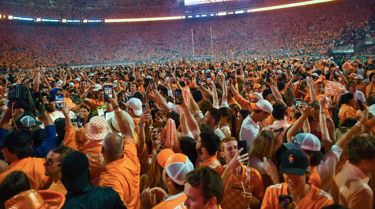 Fans storm the field after Tennessee's 52-49 win over Alabama in Neyland Stadium.